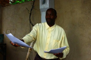 Ntahimpera Fabien handing out exam results